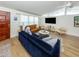 Comfortable living room featuring modern furnishings, a large TV, and bright natural light at 2933 Michigan St, Sarasota, FL 34237