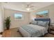 Comfortable bedroom with stylish decor, a large window, and a ceiling fan for climate control at 3276 Westford Ln, #117,, Sarasota, FL 34231