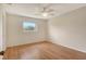 Bright bedroom offers a ceiling fan and natural light through a window overlooking the outdoors at 3276 Westford Ln, #117,, Sarasota, FL 34231