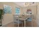 Bright dining room with modern furnishings, stylish decor, and serene natural light at 3276 Westford Ln, #117,, Sarasota, FL 34231