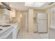 Functional kitchen offers clean appliances, tile flooring, and efficient layout for easy cooking at 3276 Westford Ln, #117,, Sarasota, FL 34231