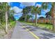 Scenic Legacy Trail path lined with palm trees, creating a tropical outdoor experience at 3276 Westford Ln, #117,, Sarasota, FL 34231
