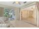 Open living area boasts sliding glass doors, tile flooring, and seamless transition to outdoor space at 3276 Westford Ln, #117,, Sarasota, FL 34231