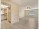 Open floor plan combines living area with kitchen featuring tile flooring for easy maintenance at 3276 Westford Ln, #117,, Sarasota, FL 34231