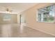 Expansive living area boasts tile flooring, large windows, and seamless indoor-outdoor transition at 3276 Westford Ln, #117,, Sarasota, FL 34231