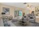 Cozy living room featuring stylish decor and seamless transition to the outdoor space at 3276 Westford Ln, #117,, Sarasota, FL 34231