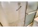 Clean shower features grab bar, glass doors, and updated flooring for added safety and style at 3276 Westford Ln, #117,, Sarasota, FL 34231