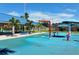 Splash pad featuring colorful water play structures, tables, and shelters for community enjoyment at 3276 Westford Ln, #117,, Sarasota, FL 34231