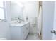 Bright bathroom features a modern vanity with marble countertop, sleek fixtures, and ample storage at 3338 Roslyn Rd, Venice, FL 34293