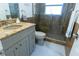 Bathroom with walk-in shower, granite vanity and neutral fixtures at 3338 Roslyn Rd, Venice, FL 34293