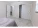 This bright bedroom leads to the bath and closet, offering a comfortable and functional layout at 3338 Roslyn Rd, Venice, FL 34293