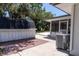 Exterior view of screened patio with pool, yard, and storage building at 3338 Roslyn Rd, Venice, FL 34293