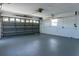 Spacious two car garage with high ceilings and single garage door at 3338 Roslyn Rd, Venice, FL 34293