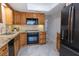 Functional kitchen design with wooden cabinets, stainless steel appliances, and modern countertops at 3338 Roslyn Rd, Venice, FL 34293