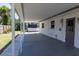 Covered patio area with exterior storage and access door at 3338 Roslyn Rd, Venice, FL 34293