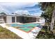 An inviting outdoor pool and screened-in lanai offers a perfect space for relaxation and entertainment at 3338 Roslyn Rd, Venice, FL 34293