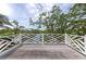 Balcony overlooking lush tropical foliage at 3737 Bayou Louise Ln, Sarasota, FL 34242