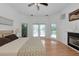 Bright bedroom with hardwood floors and a fireplace at 3737 Bayou Louise Ln, Sarasota, FL 34242