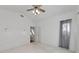 Cozy bedroom with neutral carpet, ceiling fan, and transom window at 3737 Bayou Louise Ln, Sarasota, FL 34242