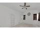 Bright bedroom with a ceiling fan, recessed shelving and windows that provide plenty of natural light at 3737 Bayou Louise Ln, Sarasota, FL 34242