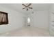 Spacious bedroom with ceiling fan, carpet flooring and two closets to maximize storage at 3737 Bayou Louise Ln, Sarasota, FL 34242