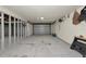 Spacious unfinished garage with concrete floor and multiple bays at 3737 Bayou Louise Ln, Sarasota, FL 34242