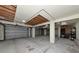 Unfinished garage with multiple bays, concrete floor and overhead storage at 3737 Bayou Louise Ln, Sarasota, FL 34242