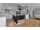 Bright kitchen with wooden floors, white cabinets and stainless steel appliances at 3737 Bayou Louise Ln, Sarasota, FL 34242