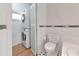 View of the laundry room with stacked washer and dryer next to a full bathroom at 3737 Bayou Louise Ln, Sarasota, FL 34242