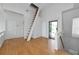 Open and airy loft space with hardwood floors and access to a balcony at 3737 Bayou Louise Ln, Sarasota, FL 34242