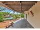 Covered patio features stone stools with views of the water and private dock at 3737 Bayou Louise Ln, Sarasota, FL 34242