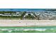 Stunning aerial view of beachfront condos boasting access to white sand and turquoise ocean waters at 3802 Gulf Of Mexico Dr # A205, Longboat Key, FL 34228