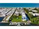 Beautiful aerial view of beachfront condominiums with boat docks and immaculate landscaping at 3802 Gulf Of Mexico Dr # A205, Longboat Key, FL 34228