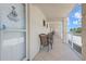 Spacious outdoor balcony with seating and ocean views at 3802 Gulf Of Mexico Dr # A205, Longboat Key, FL 34228