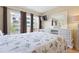 Bright bedroom with natural light, sleek decor, and a comfortable queen size bed at 3802 Gulf Of Mexico Dr # A205, Longboat Key, FL 34228