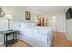 Comfortable bedroom with a view of a walk-in closet and bathroom at 3802 Gulf Of Mexico Dr # A205, Longboat Key, FL 34228