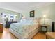 Well-lit bedroom with a calming ambiance, a queen bed, and tasteful decor at 3802 Gulf Of Mexico Dr # A205, Longboat Key, FL 34228