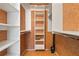 Walk-in closet with built-in white shelving units for maximum storage at 3802 Gulf Of Mexico Dr # A205, Longboat Key, FL 34228