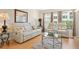 Inviting living room featuring neutral decor, comfortable seating, and abundant natural light at 3802 Gulf Of Mexico Dr # A205, Longboat Key, FL 34228