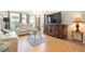 Comfortable living room with lots of natural light, stylish furniture, and a large television at 3802 Gulf Of Mexico Dr # A205, Longboat Key, FL 34228