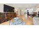 Comfortable living room with a large television, decorative furnishings, and an open view at 3802 Gulf Of Mexico Dr # A205, Longboat Key, FL 34228