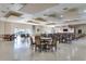 A spacious meeting room that provides tables and chairs for residents at 3802 Gulf Of Mexico Dr # A205, Longboat Key, FL 34228