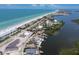 Coastal neighborhood with beach access, boat docks, and waterfront homes on a sunny day at 4 Winslow Pl, Longboat Key, FL 34228