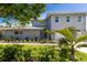 Inviting two-story home with meticulously landscaped front yard, and a convenient two-car garage at 4 Winslow Pl, Longboat Key, FL 34228