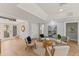 Living room with wood floors, comfortable seating, neutral decor, and lots of natural light at 4 Winslow Pl, Longboat Key, FL 34228