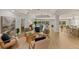 Open-concept living room showcasing wood floors, neutral decor and stunning water views at 4 Winslow Pl, Longboat Key, FL 34228
