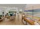 Bright living room featuring wood floors, recessed lighting, neutral decor and beautiful water views at 4 Winslow Pl, Longboat Key, FL 34228