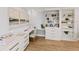 Office space with elegant decor, built-in shelving, and modern cabinets at 4 Winslow Pl, Longboat Key, FL 34228