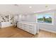 Bright office with custom built-ins and a water view, featuring hardwood floors and plenty of natural light at 4 Winslow Pl, Longboat Key, FL 34228