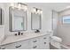 Renovated bathroom features double vanity with marble countertops and walk-in shower at 4131 Oakhurst W Cir # 3133, Sarasota, FL 34233